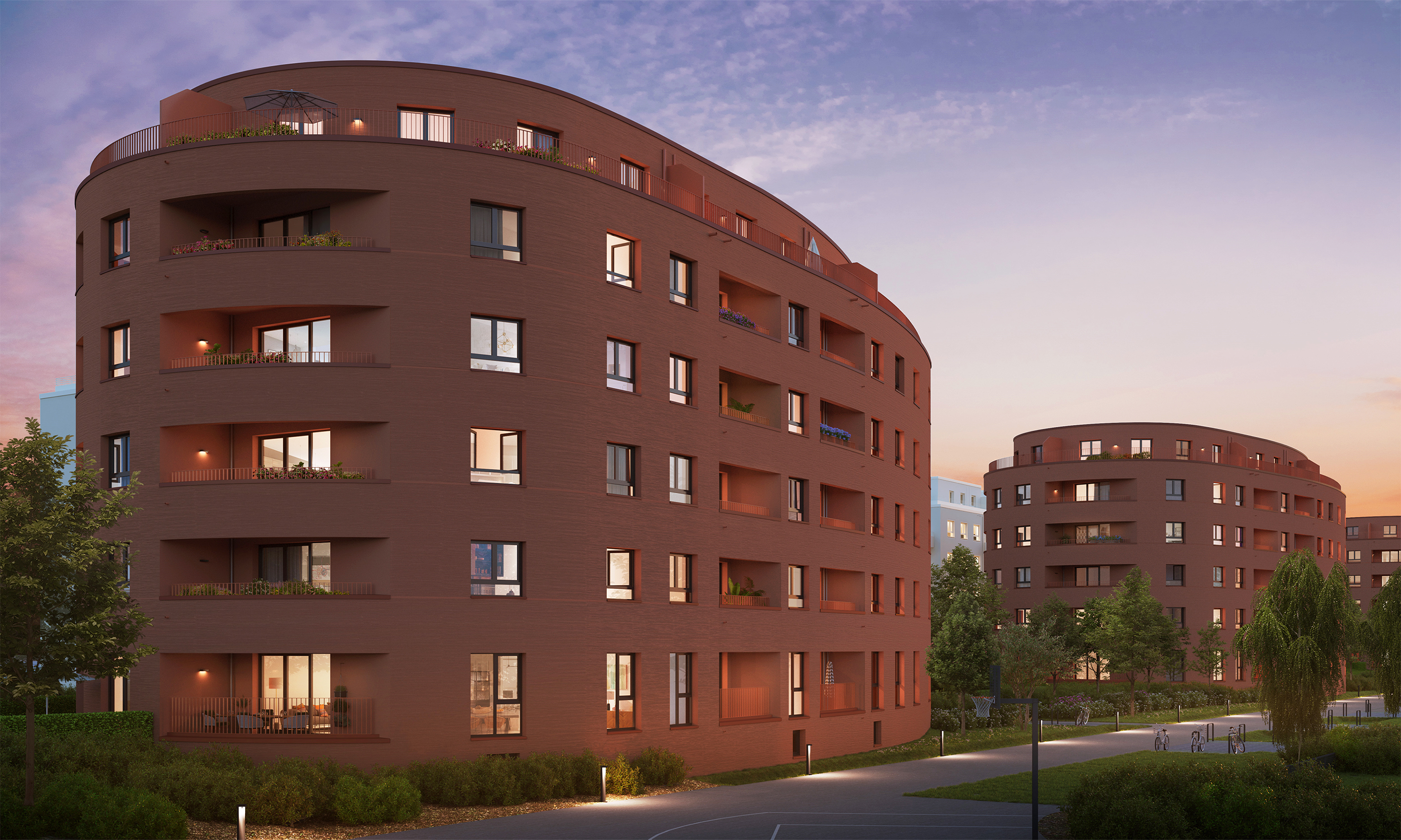 Zu sehen sind zwei rote, runde Gebäude.